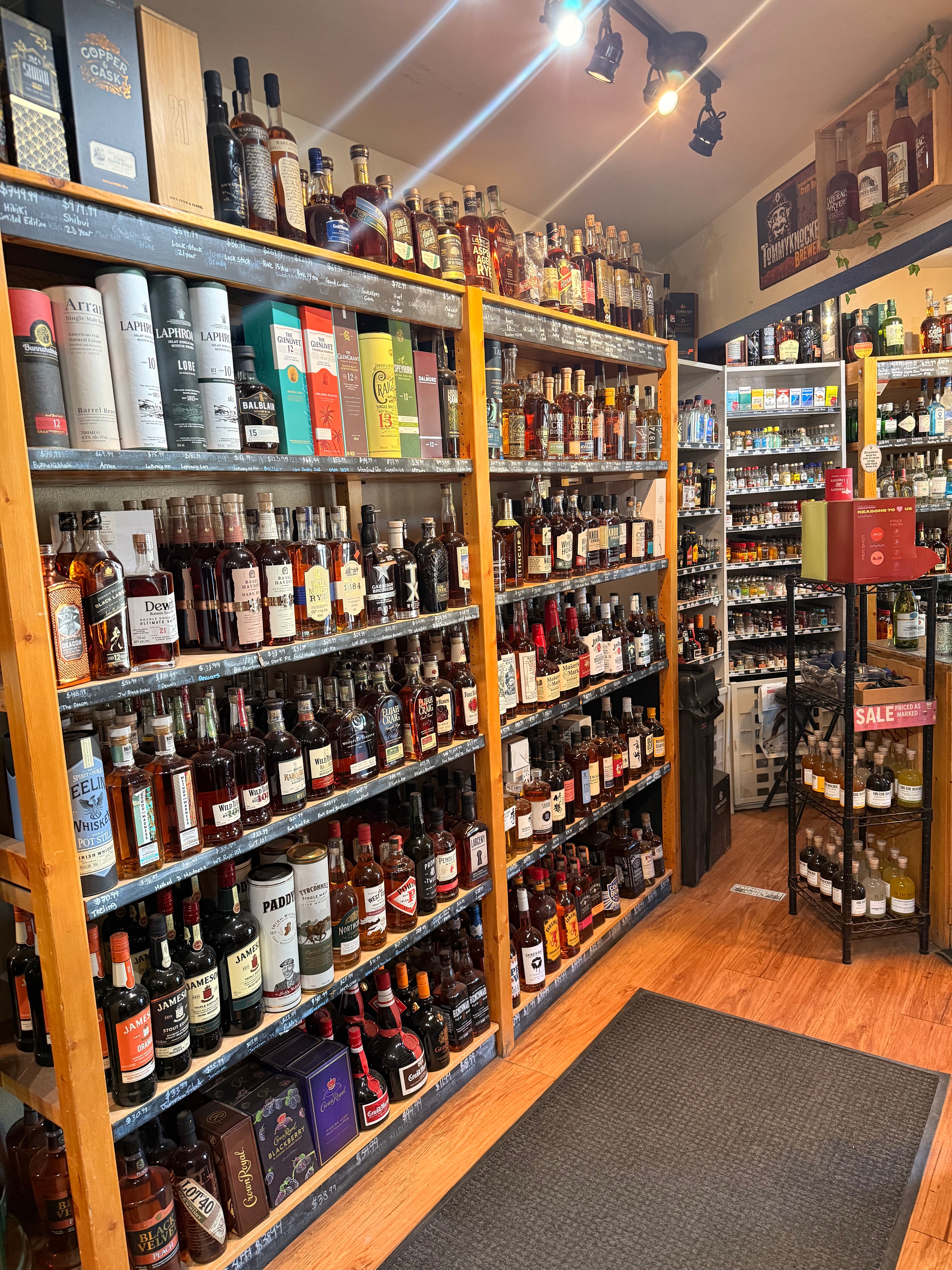 Inside Treasury Liquors — well-stocked shelves of spirits, wine, and beer