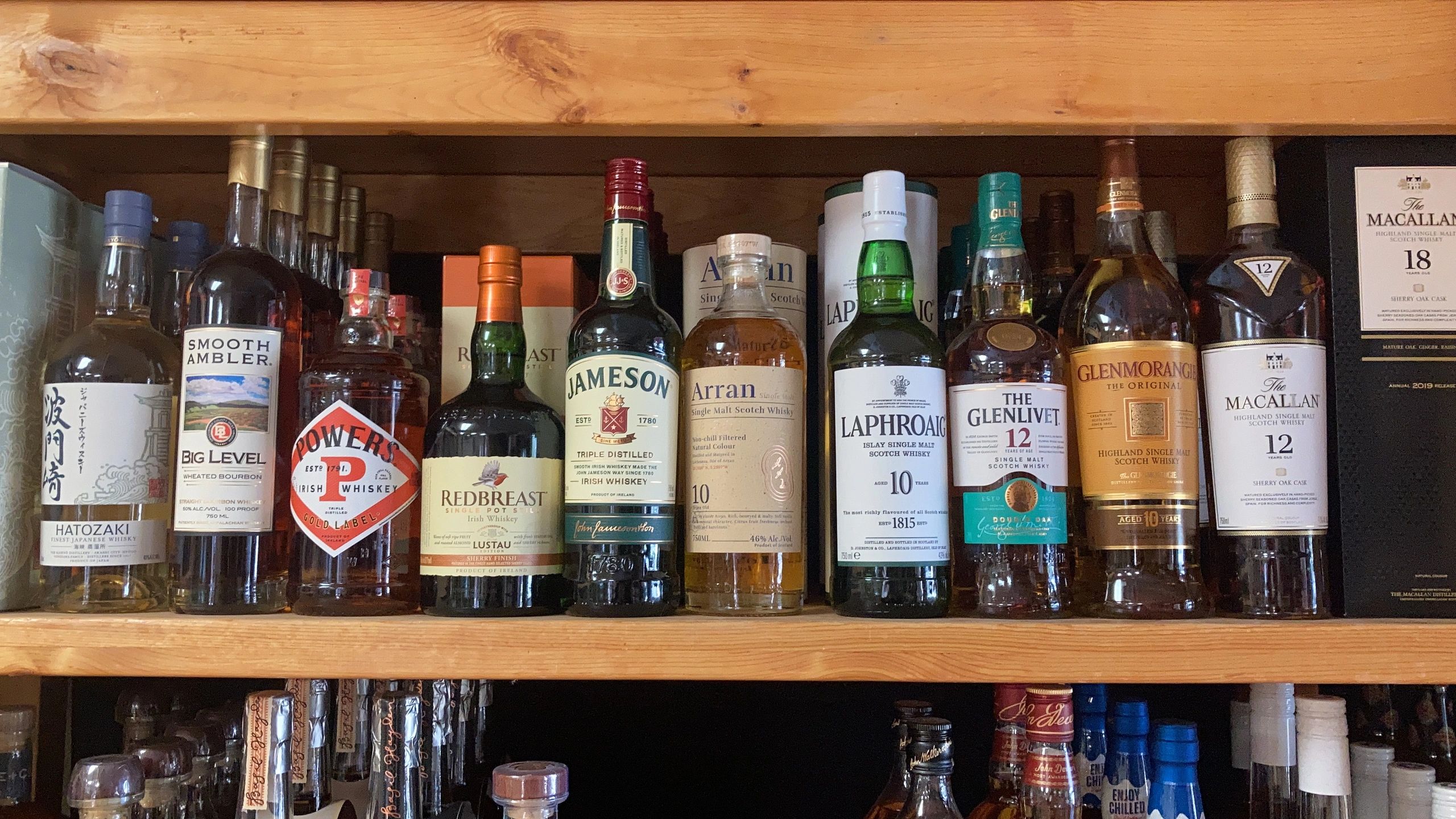 Curated whiskey shelf at Treasury Liquors